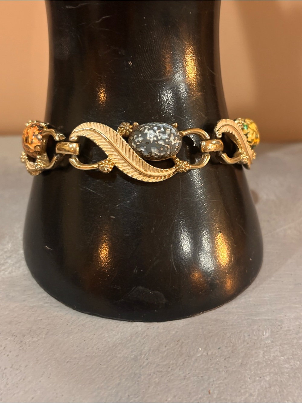 Gold tone five stone bracelet